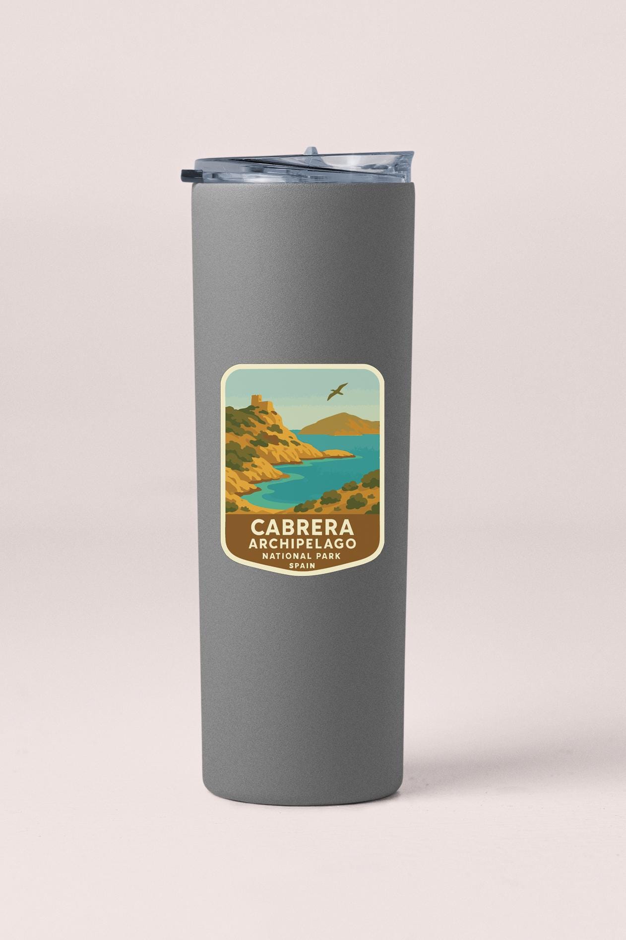 A gray insulated tumbler with a label that says "CABRERA ARCHIPELAGO NATIONAL PARK SPAIN".