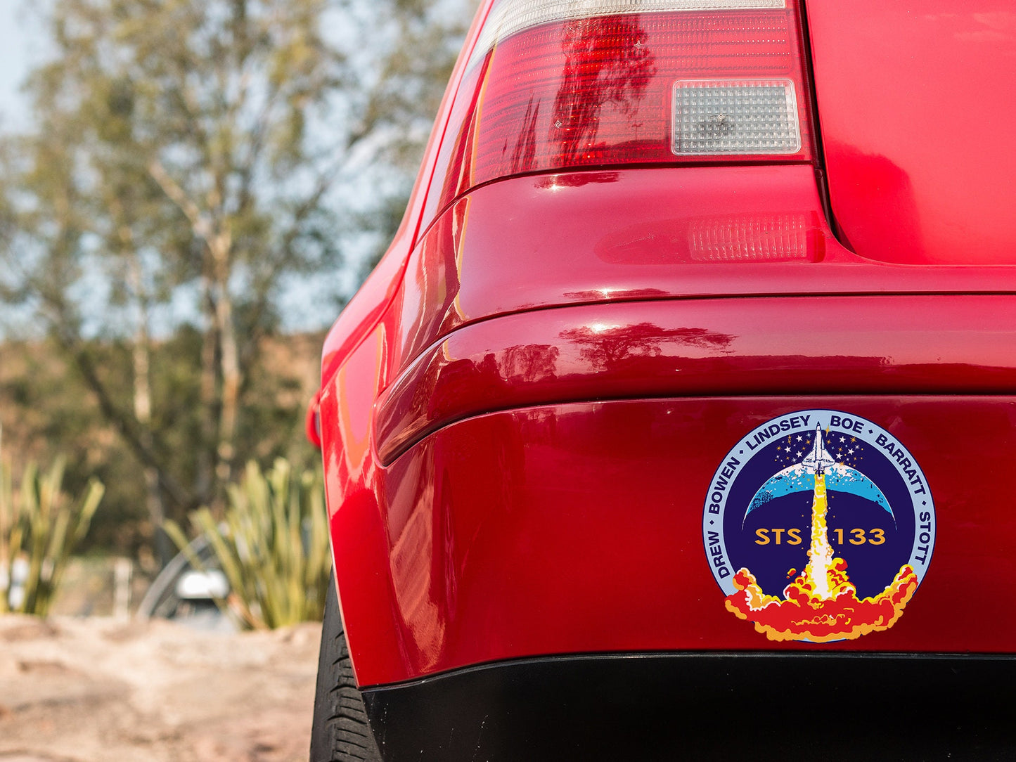 a close up of the rear end of a red car