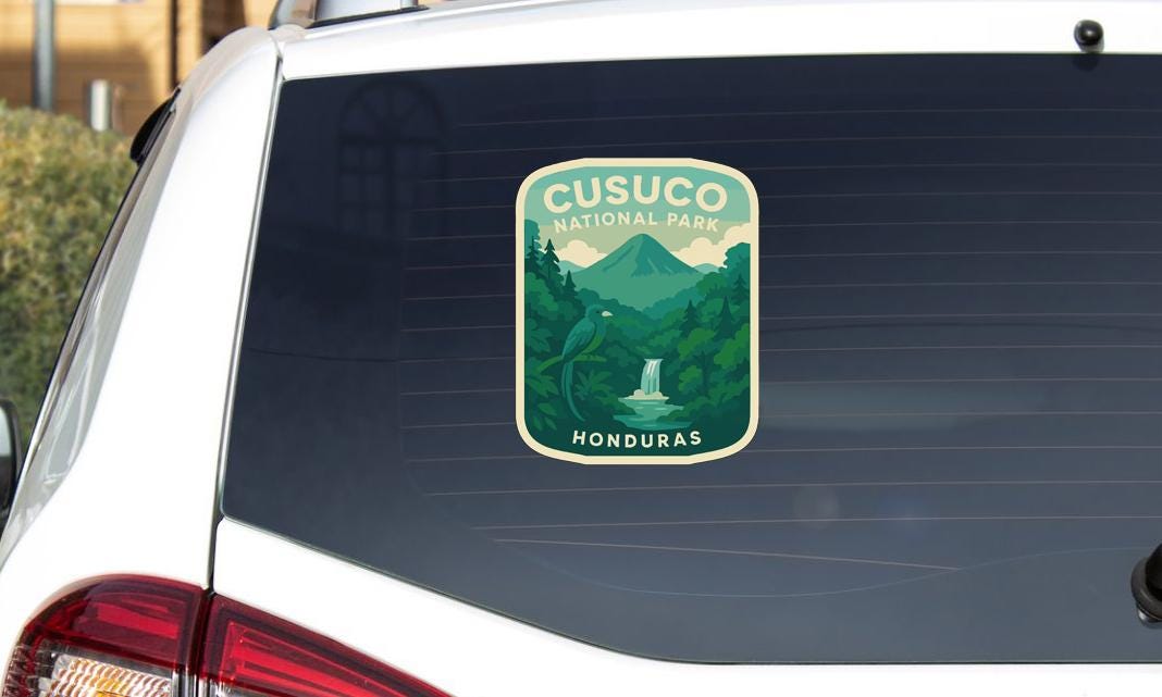 A sticker on the rear window of a car that says "Cusucu National Park Honduras".