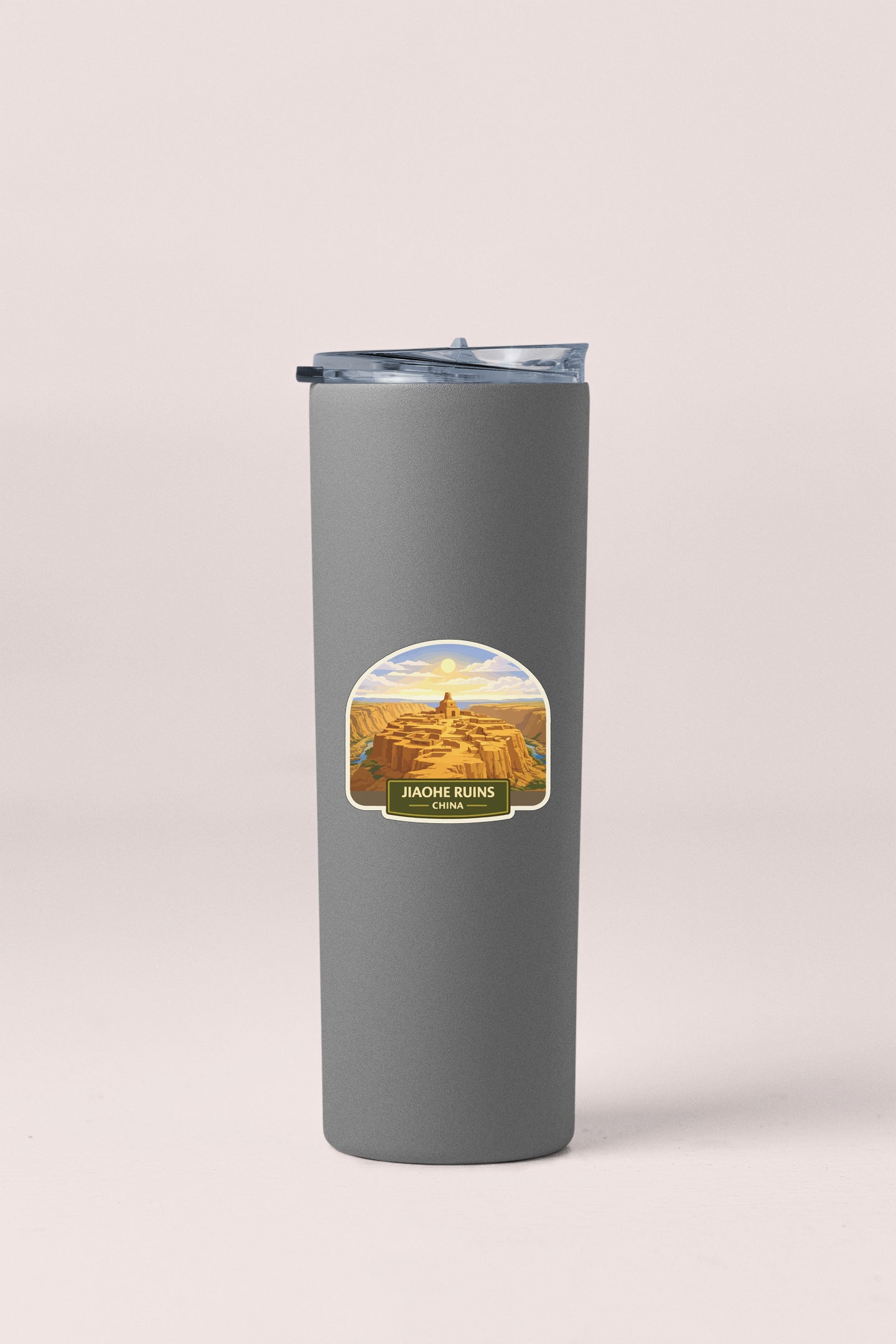 A gray insulated tumbler with a label that says "JACHE RUINS CHINA".
