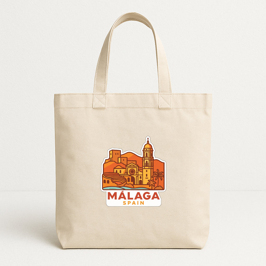 A beige tote bag with a printed design depicting the city of Malaga, Spain.