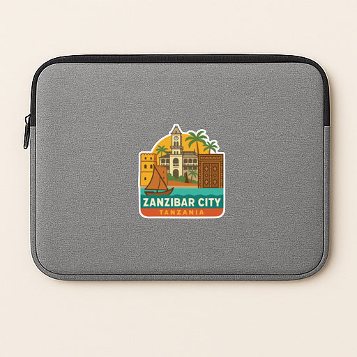 A gray laptop sleeve with a sticker depicting the landmarks and architecture of Zanzibar City, Tanzania.