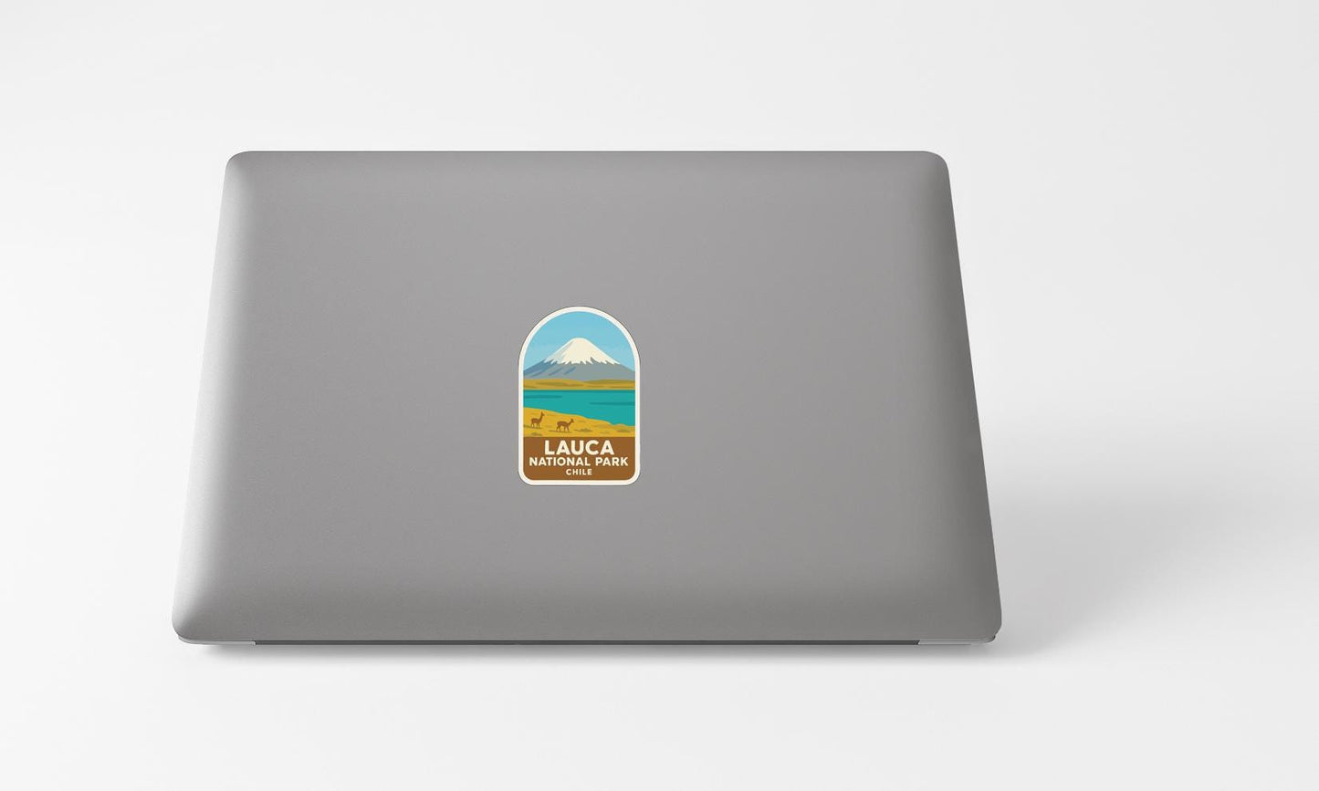 A sticker with a mountain and lake image on a laptop.