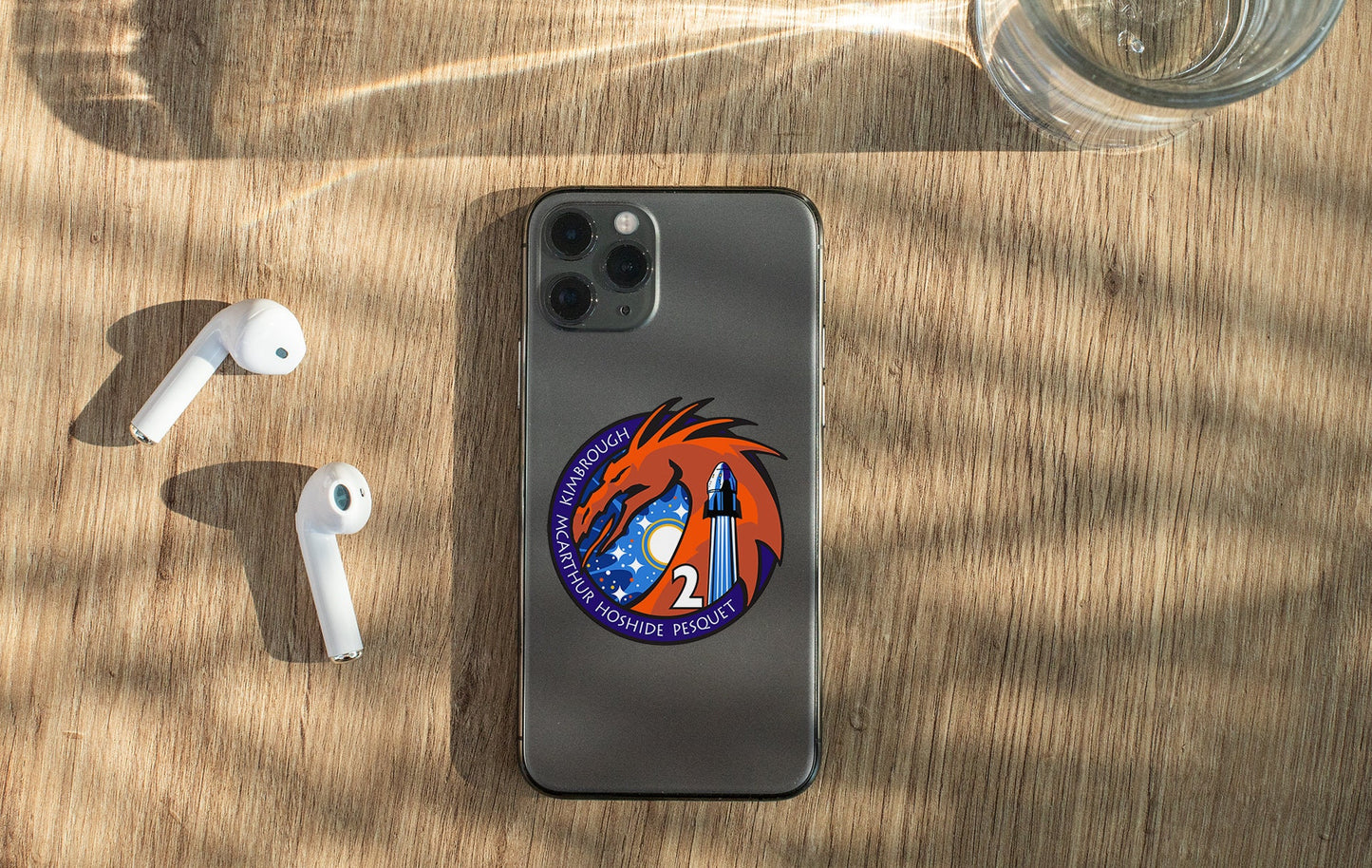 a cell phone sitting on top of a wooden table