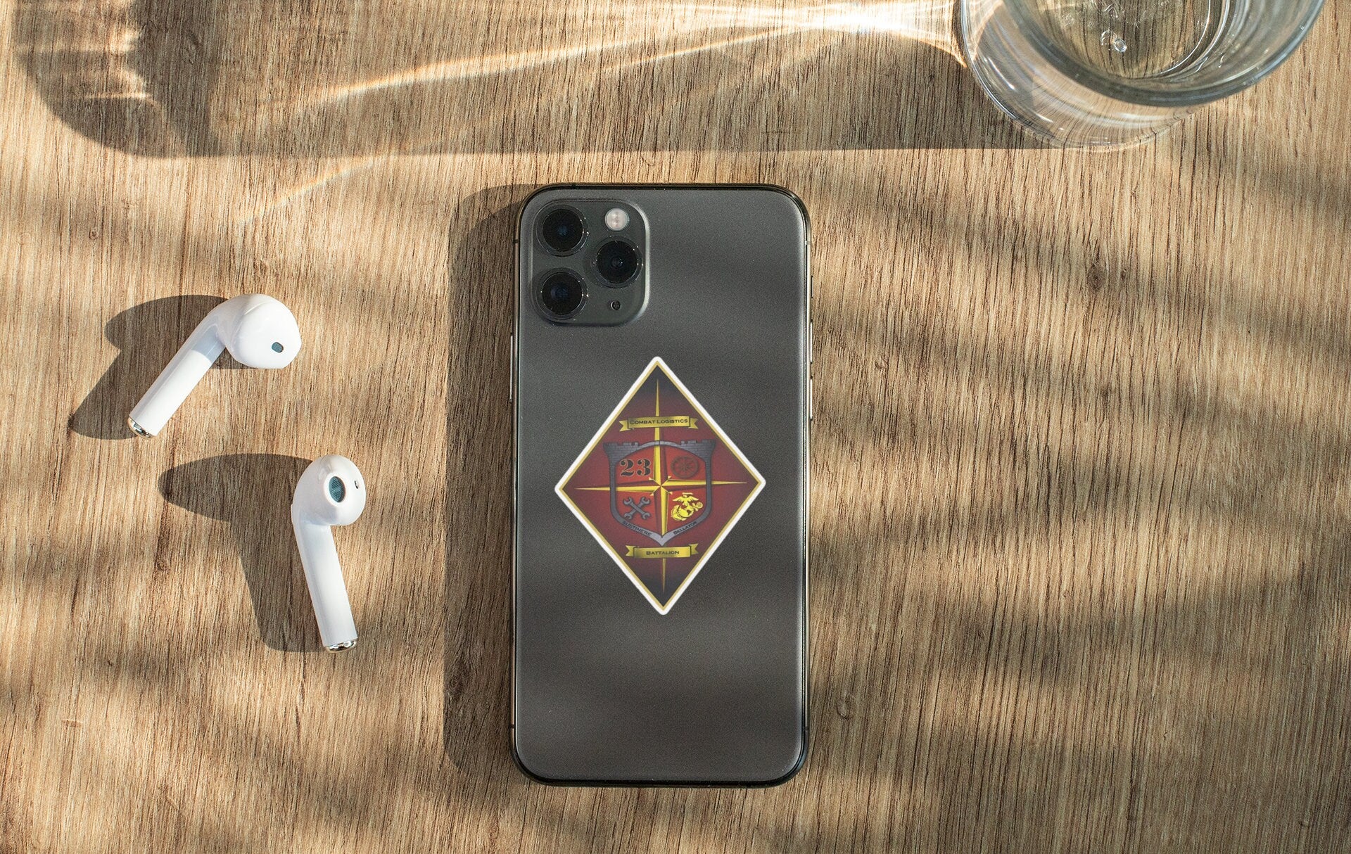 a phone and ear buds sitting on a table