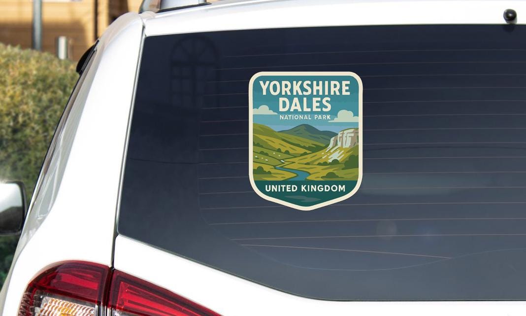 A sticker on the rear window of a car that says "Yorkshire Dales National Park United Kingdom".