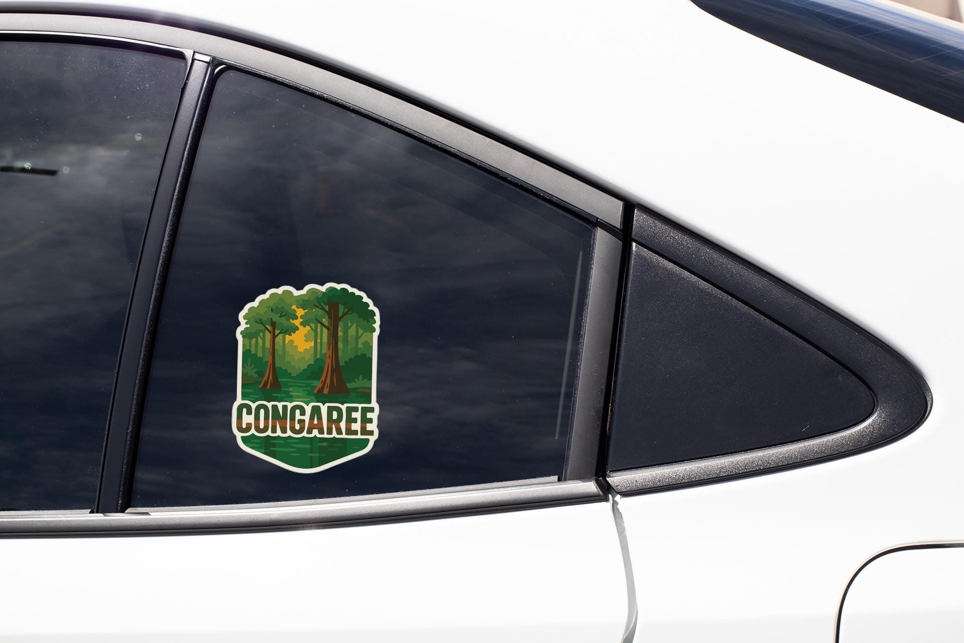A sticker on the side of a car window that says "CONGAREE".