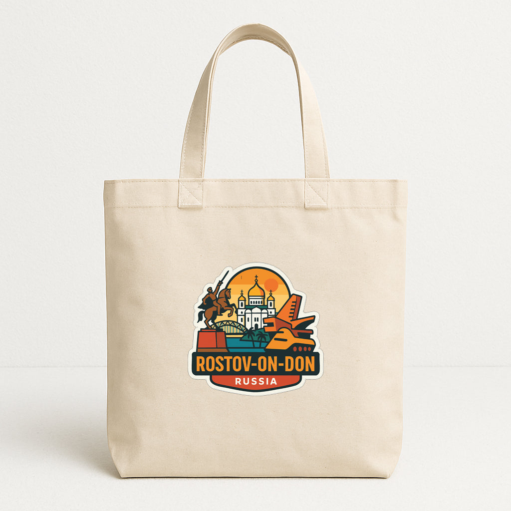 A beige tote bag with a colorful graphic design featuring various landmarks and text, including "Rostov-on-Don Russia".