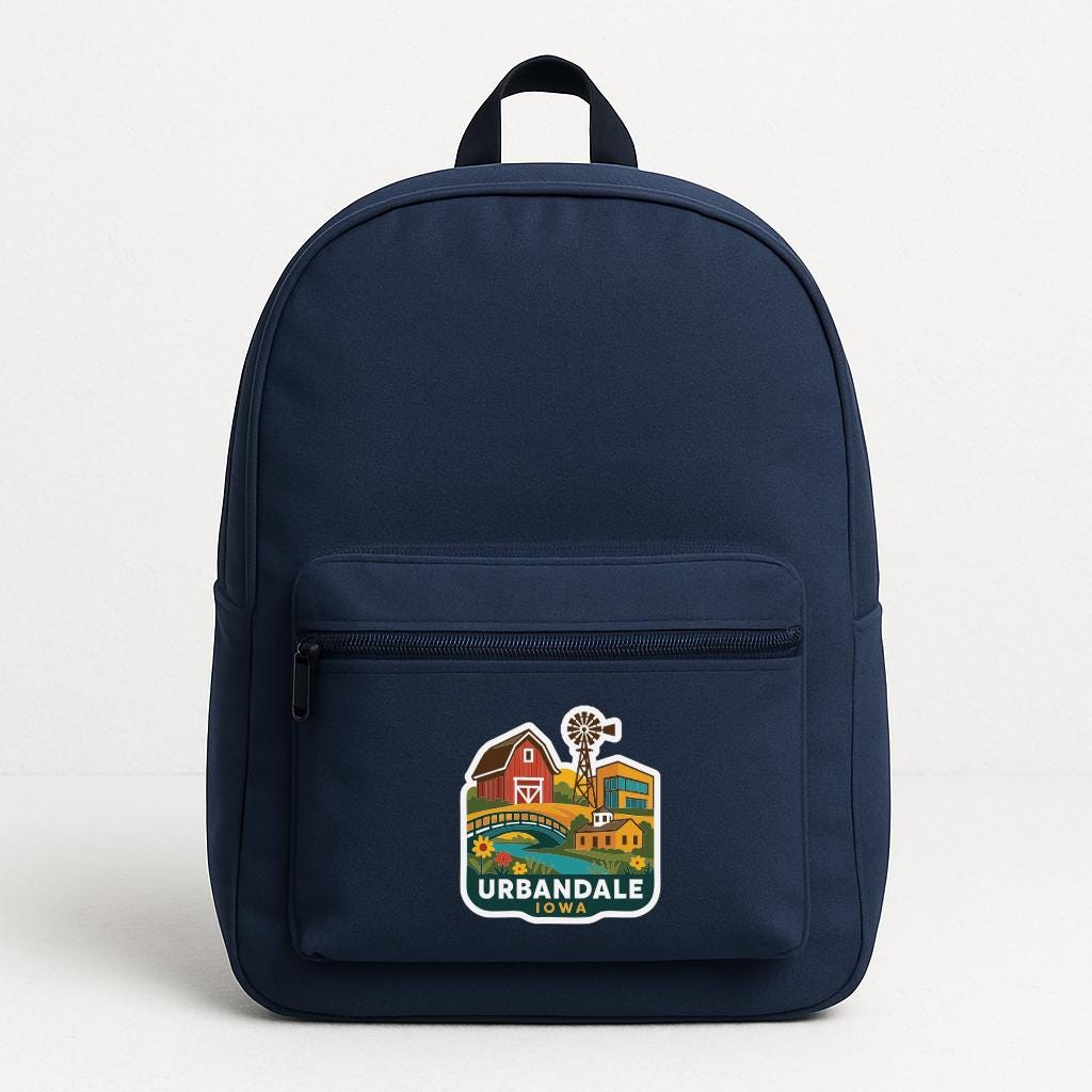 A navy blue backpack with a graphic design on the front pocket.