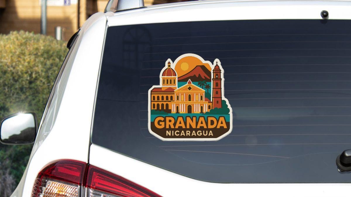 A sticker on the rear window of a car that says "GRANADA NICARAGUA".