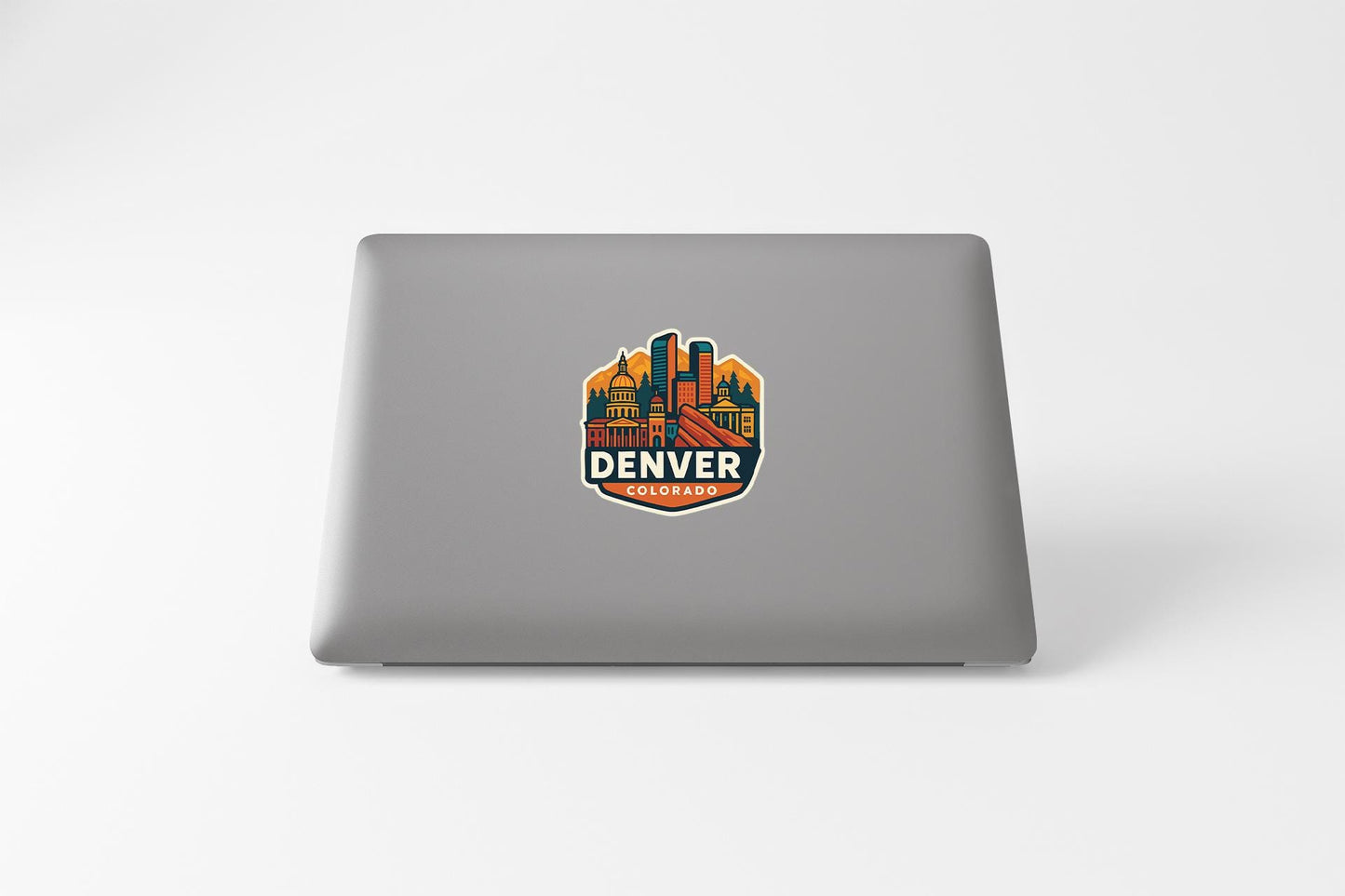 a laptop with a sticker of a city on it
