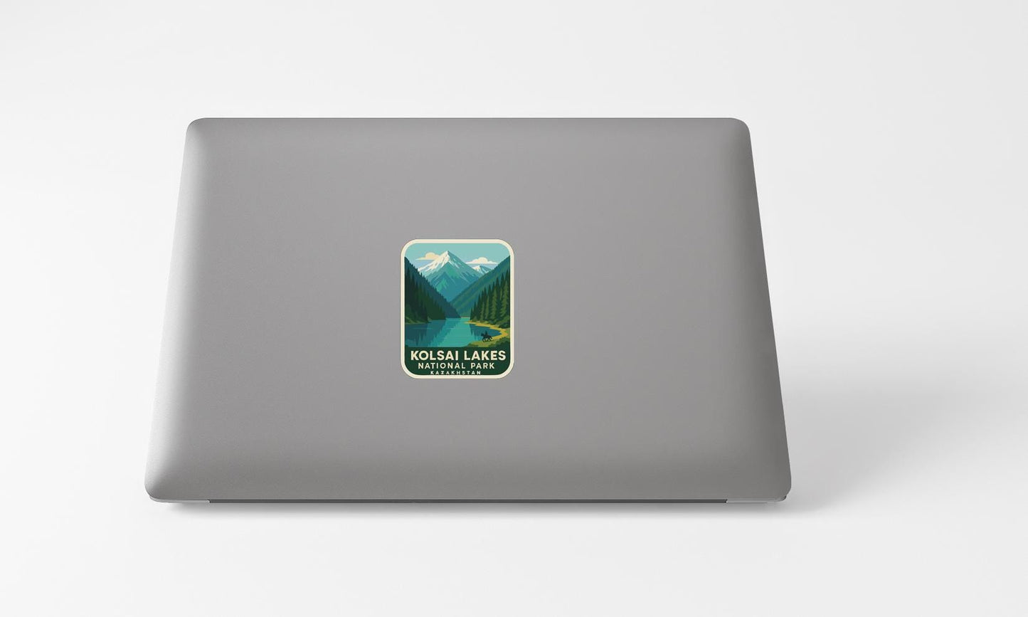 A sticker with a mountain landscape on a laptop.