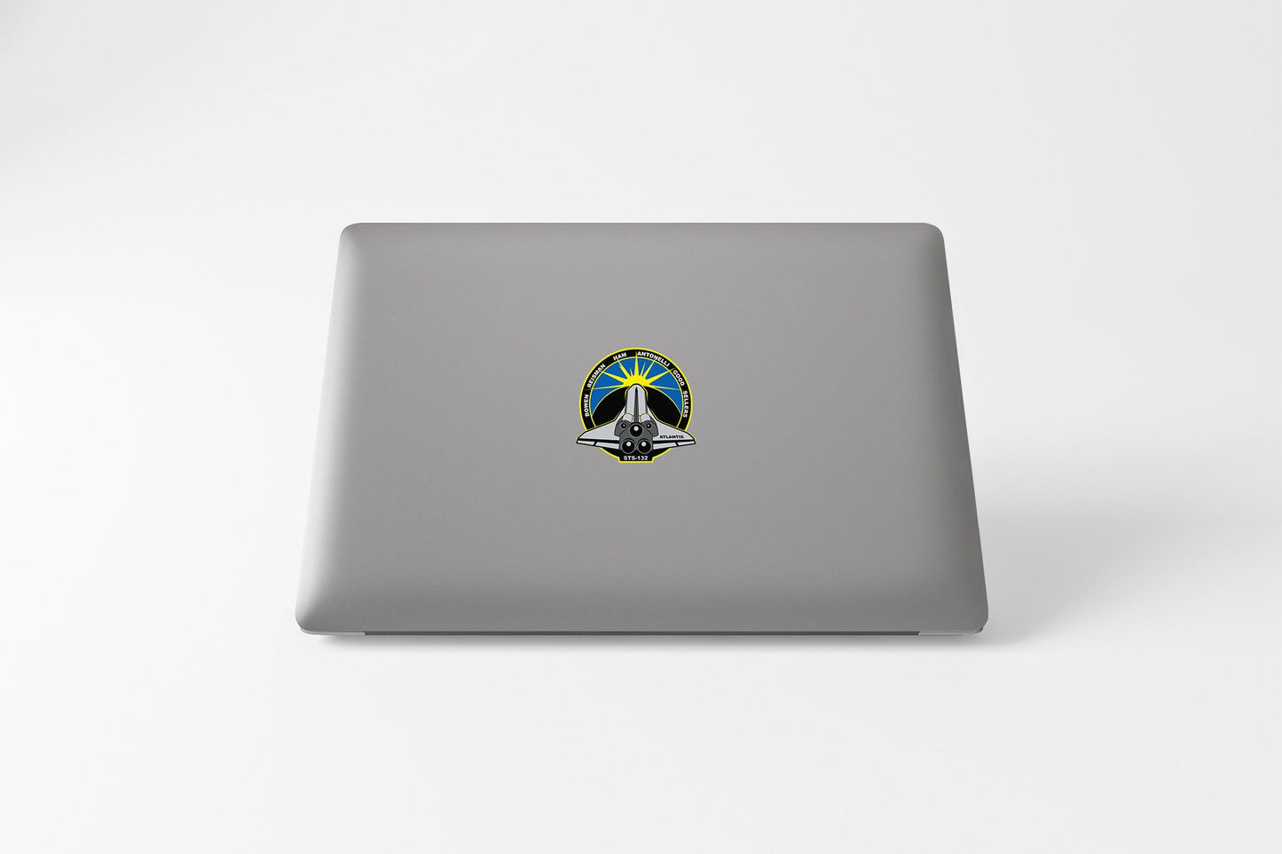 a laptop computer with a peace sign on it