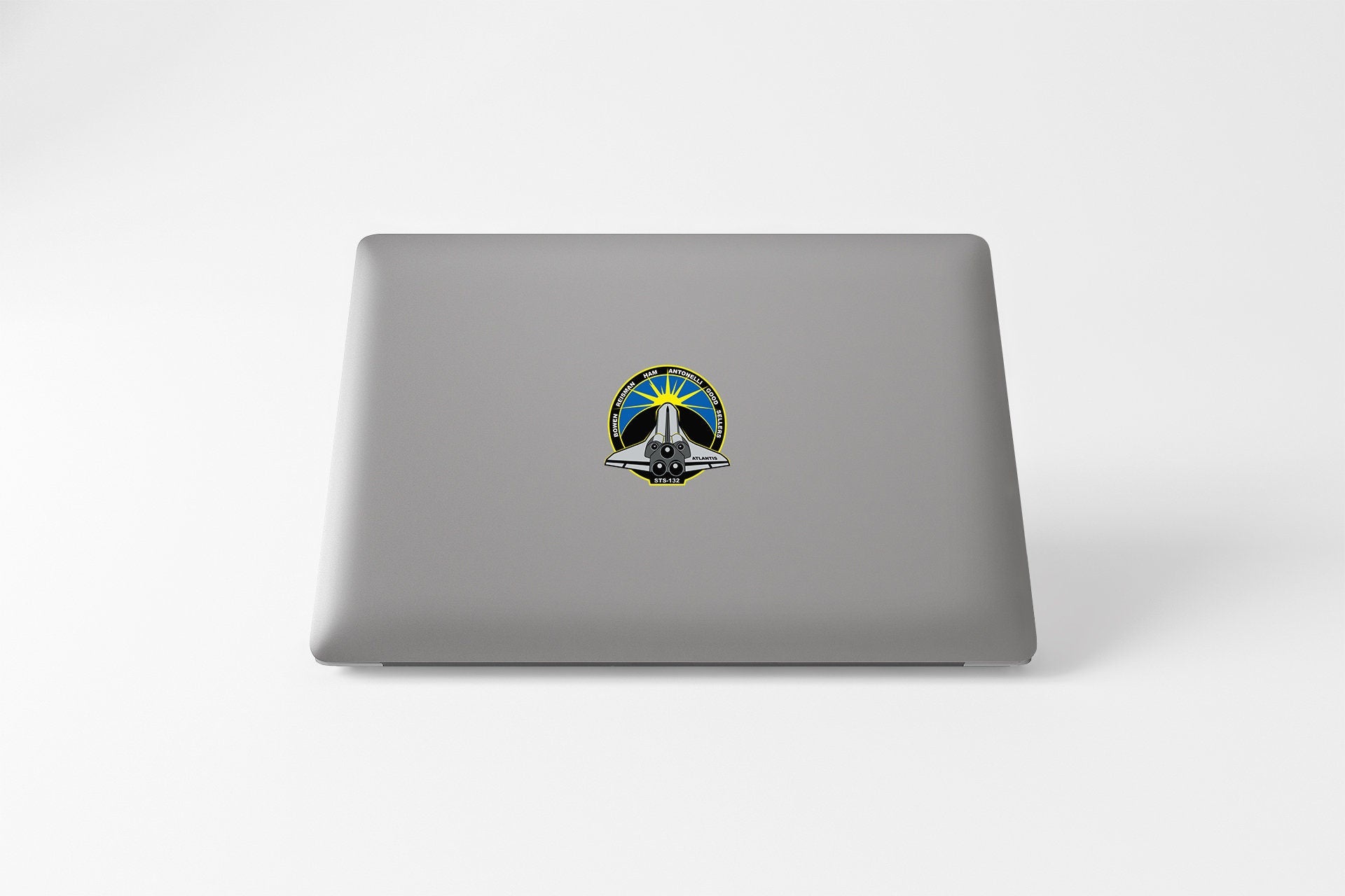 a laptop computer with a peace sign on it