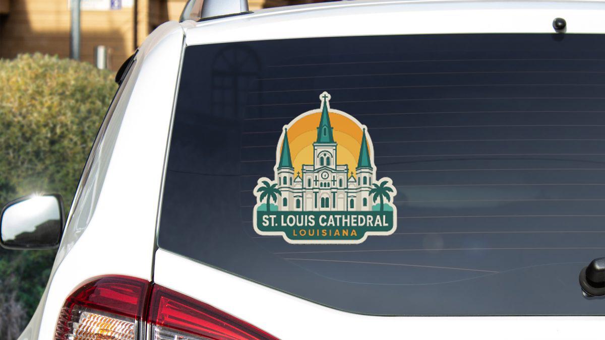 St. Louis Cathedral logo sticker on the rear window of a white vehicle.