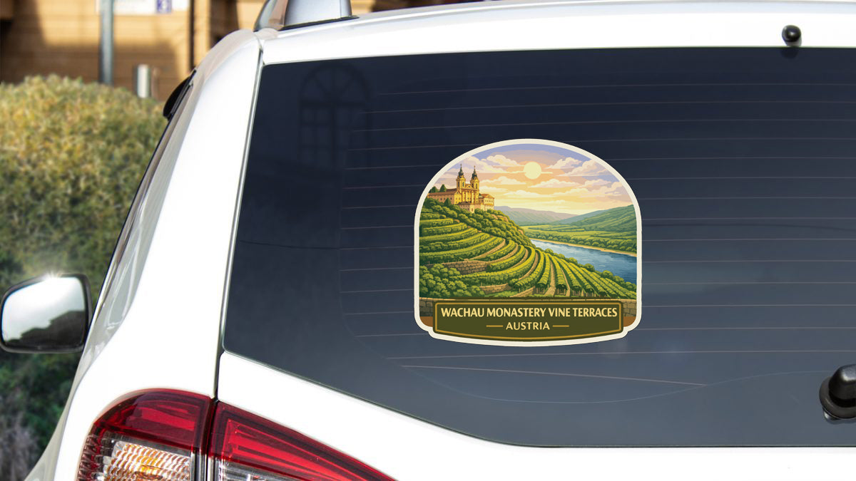 a sticker on the rear window of a car, depicting a scenic landscape with vineyards and a castle.