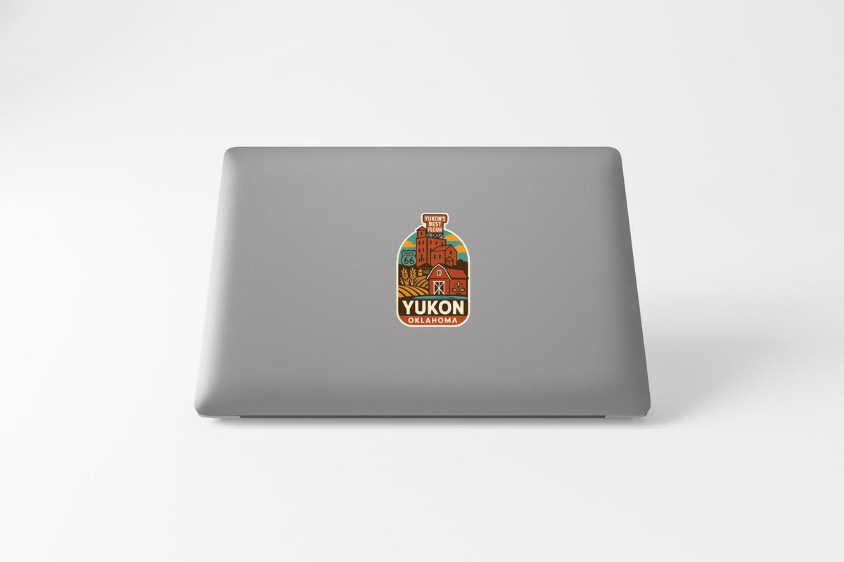 A sticker on the back of a laptop, featuring a colorful design with text and graphics.