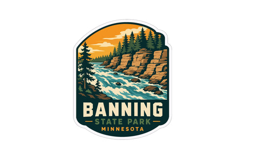 A sticker or emblem featuring a scenic landscape with a river, rocky cliffs, pine trees, and a sunset sky. The text "BANNING STATE PARK MINNESOTA" is prominently displayed, indicating the location or theme of the image.