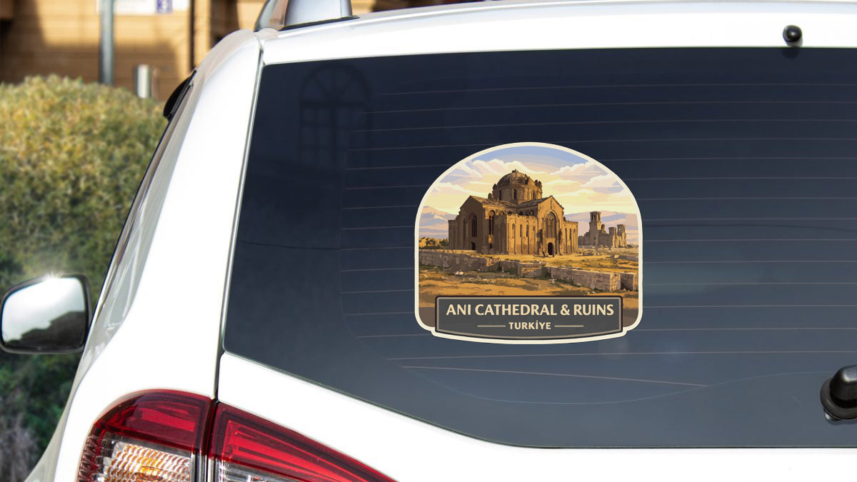 a sticker on the rear window of a car that displays an illustration of a cathedral and ruins, along with the text "ANI CATEDRAL & RUINS TURKEY".