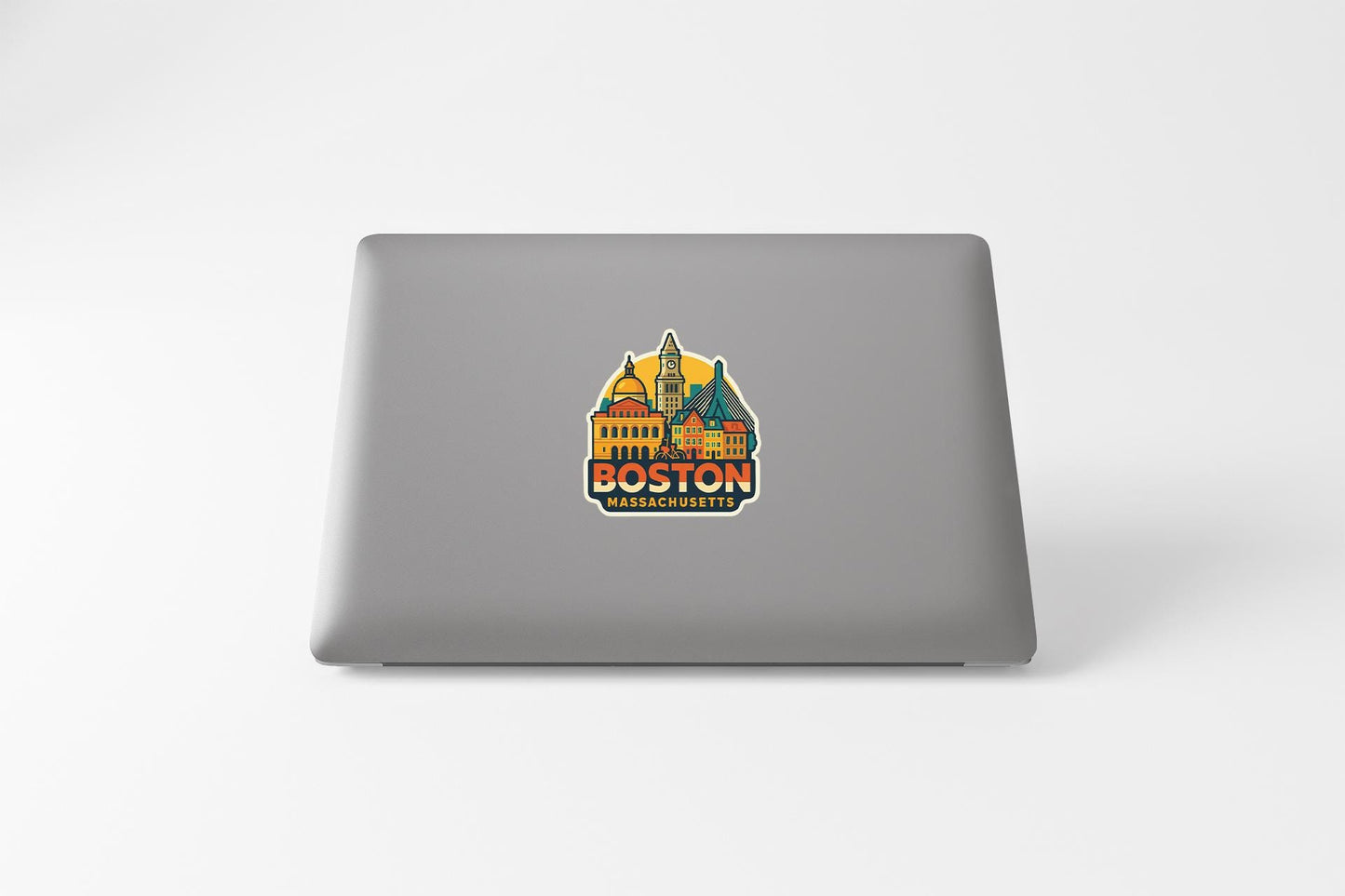 a laptop computer with a sticker of a boston skyline