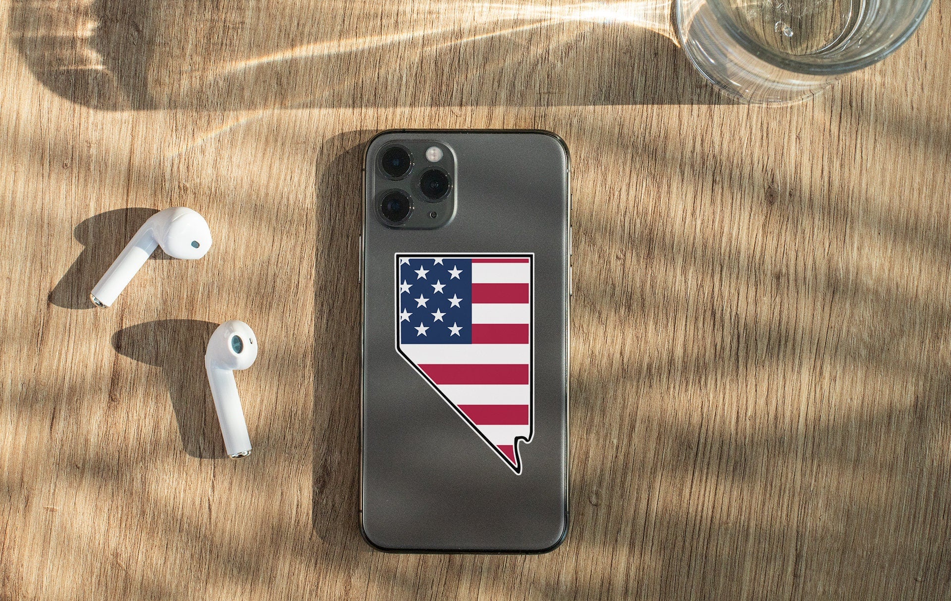 a cell phone with a sticker of the state of arizona on it