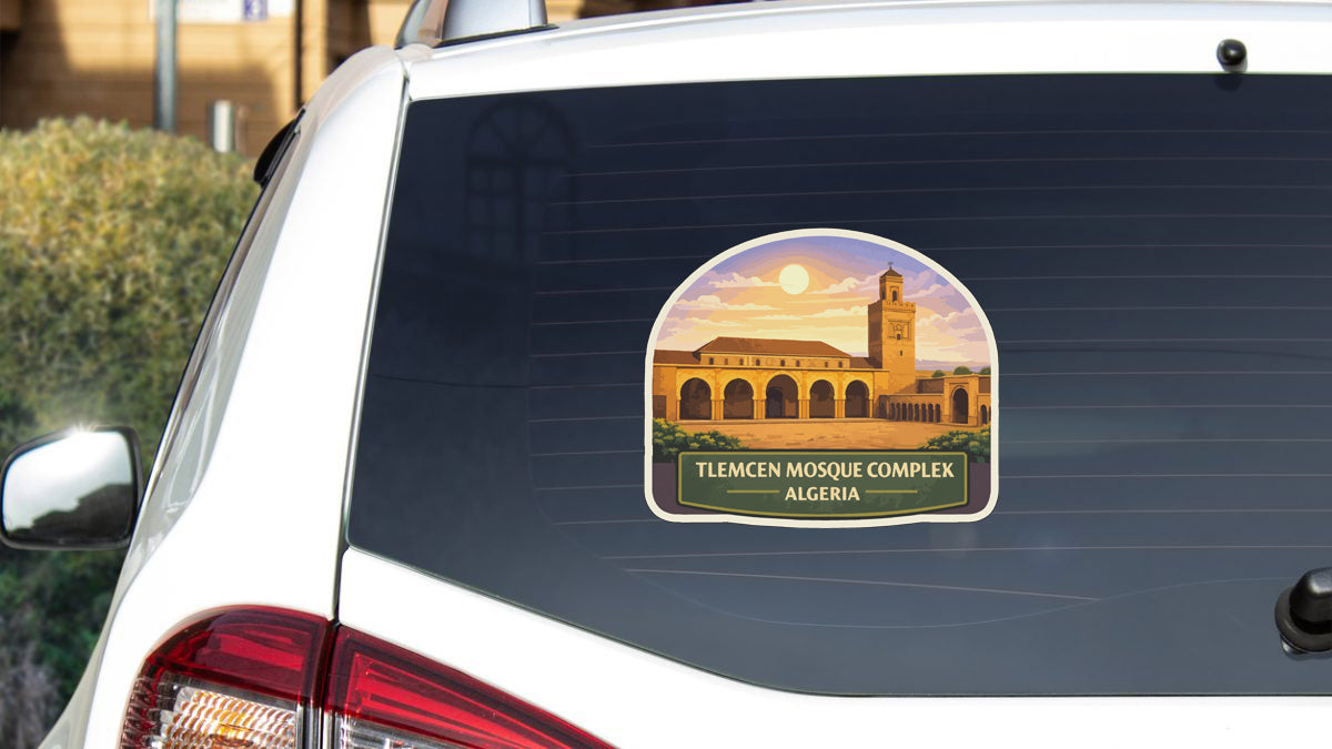 a sticker on the rear window of a white car, depicting the Tlemcen Mosque Complex in Algeria.