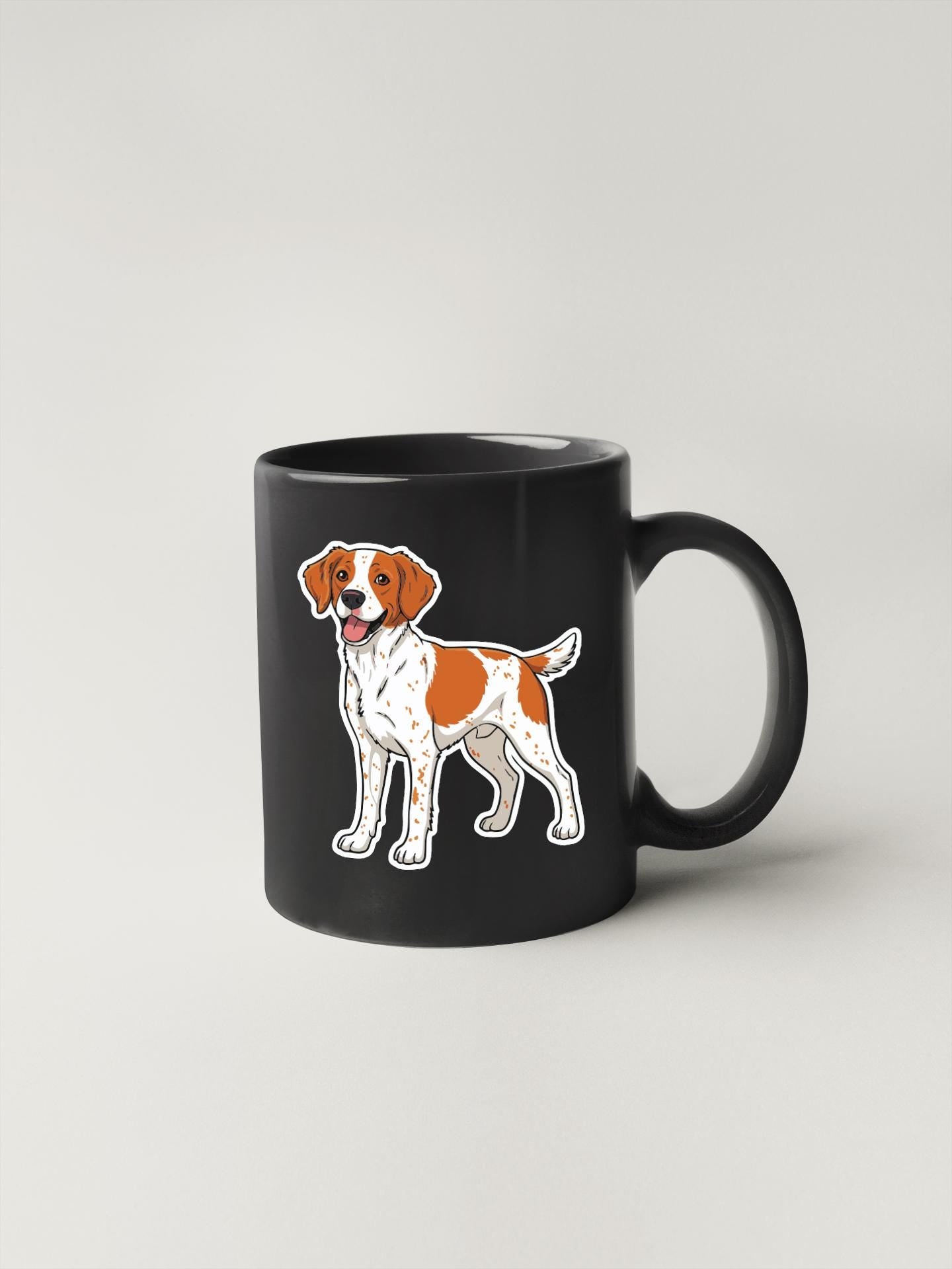A black mug with a cartoon illustration of a dog on it.