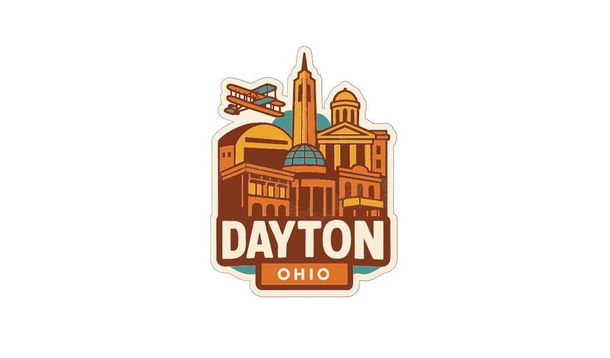 A sticker or emblem featuring the city of Dayton, Ohio, with various landmarks and buildings depicted in a stylized manner.