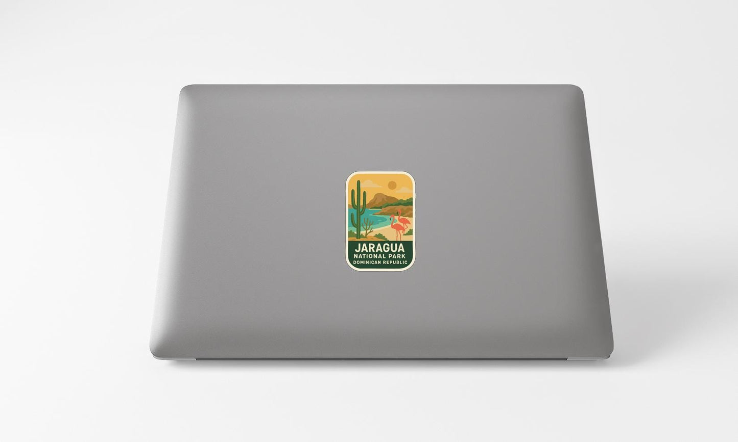 A sticker with a desert landscape and cactus on a laptop.