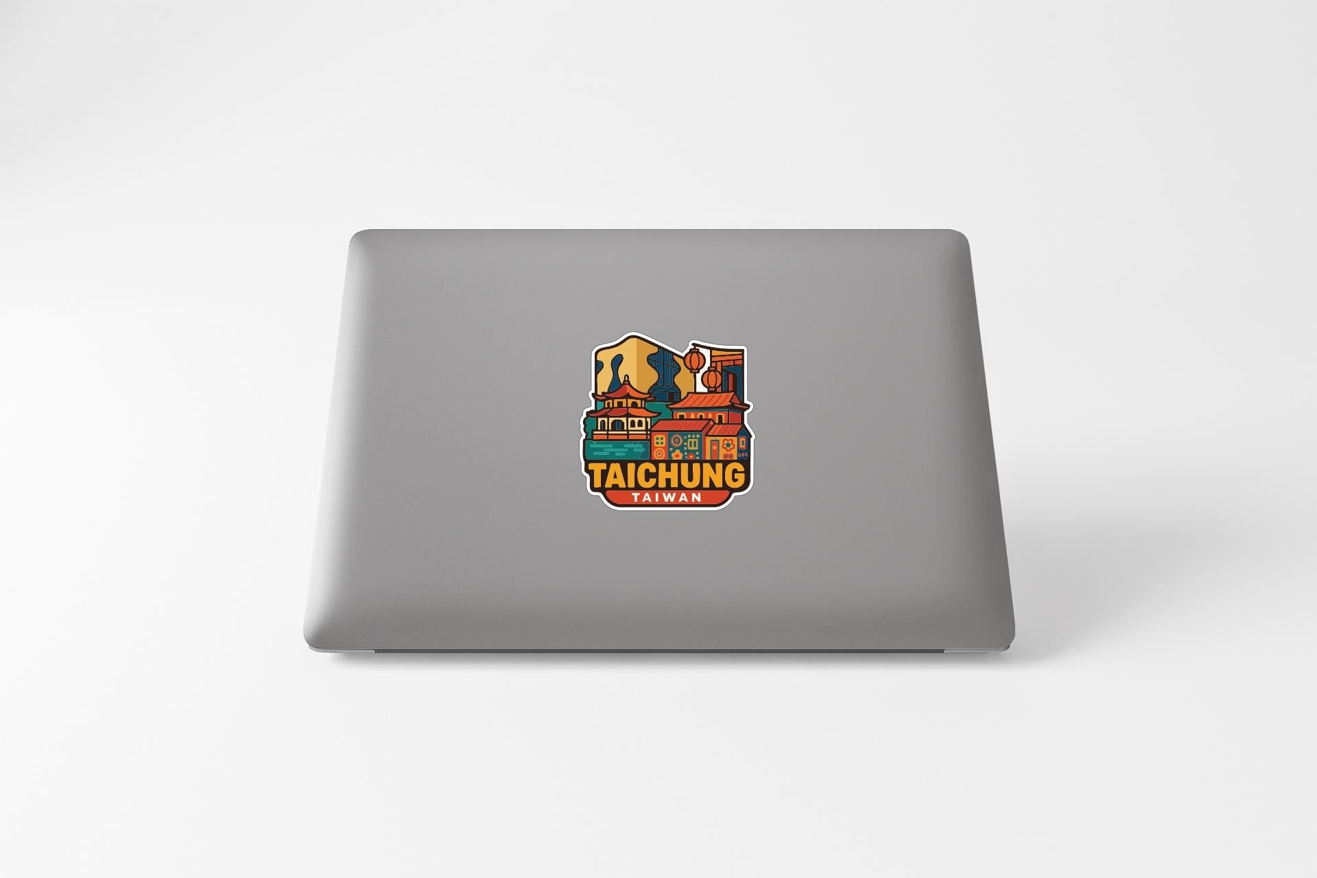 a sticker on the back of a laptop that says "TAICHUNG TAIWAN".