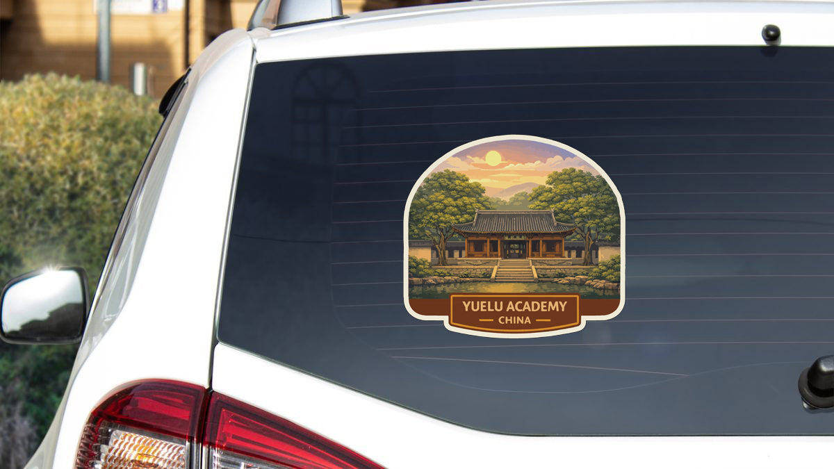 A sticker on the rear window of a car depicting a traditional Chinese temple.