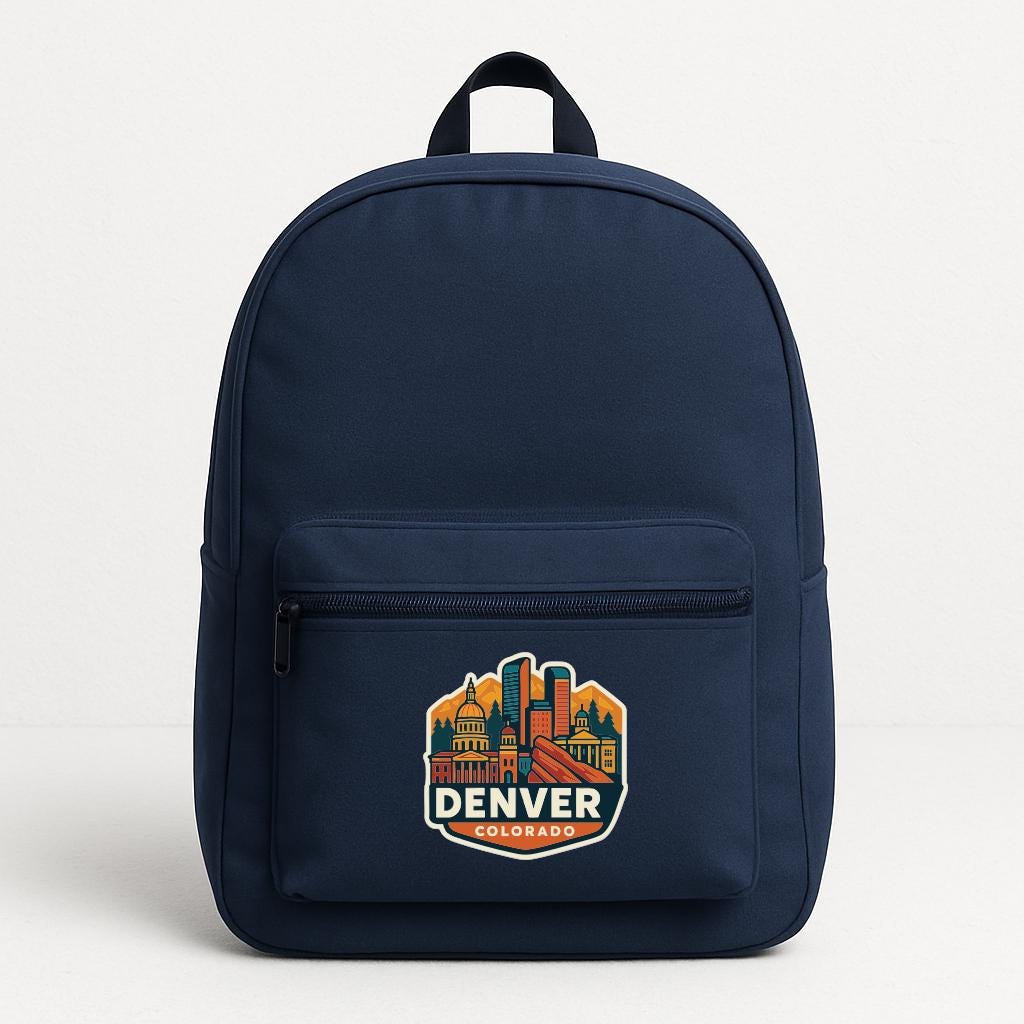 A navy blue backpack with a graphic of the Denver skyline printed on it.