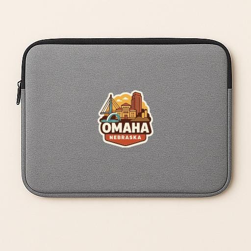 A gray laptop sleeve with a graphic of the Omaha, Nebraska skyline printed on it.