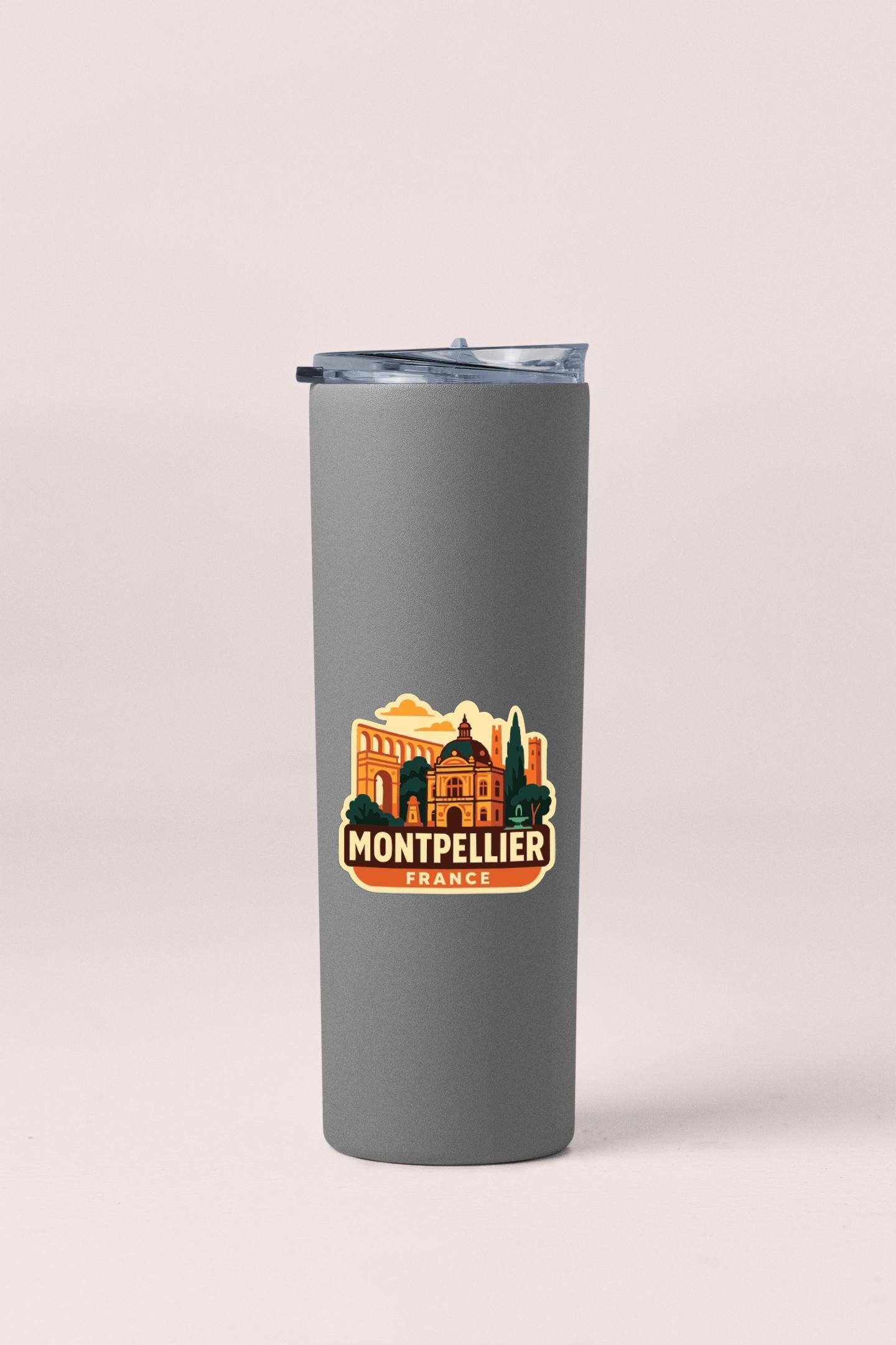 A gray insulated tumbler with a printed label that says "MONTEFALLER FRANCE".