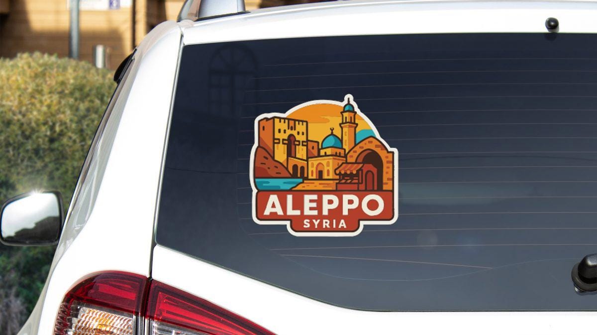 A sticker on the rear window of a car that says "ALEPPO SYRIA".