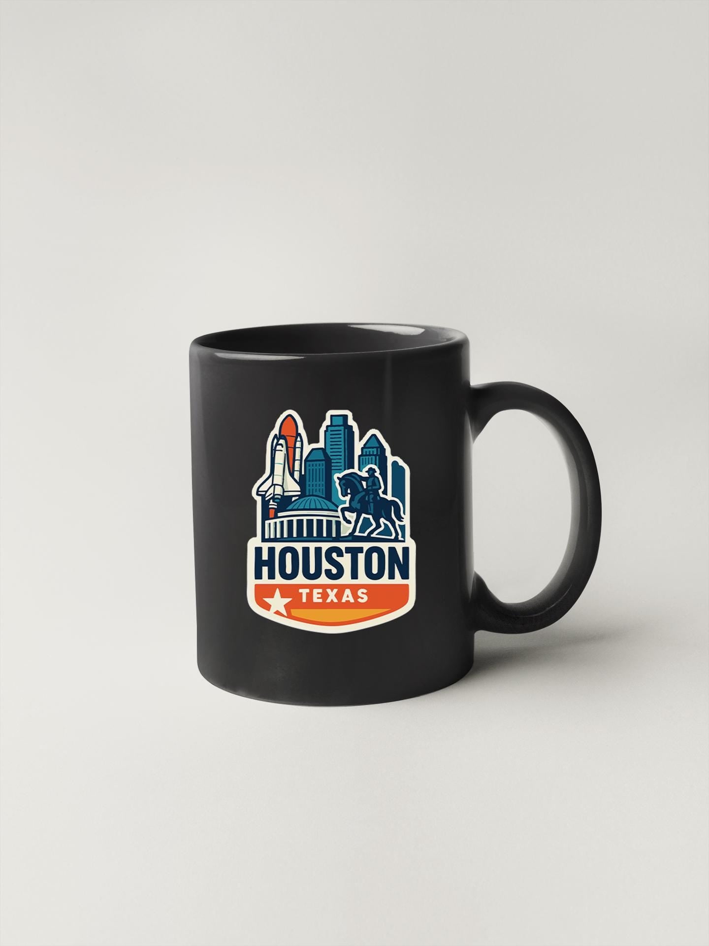 a black coffee mug with a houston texas skyline on it