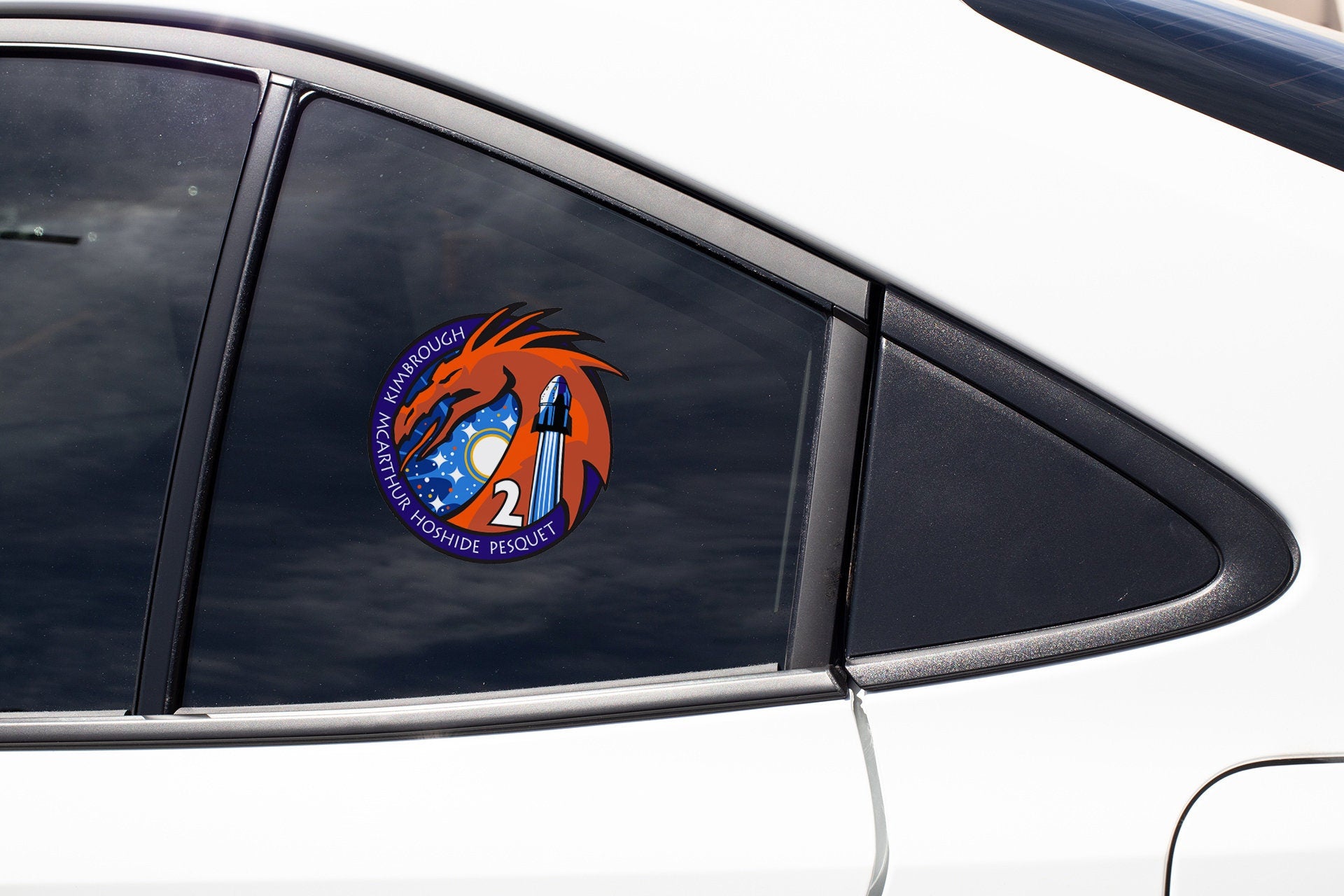 a close up of a car window with a sticker on it