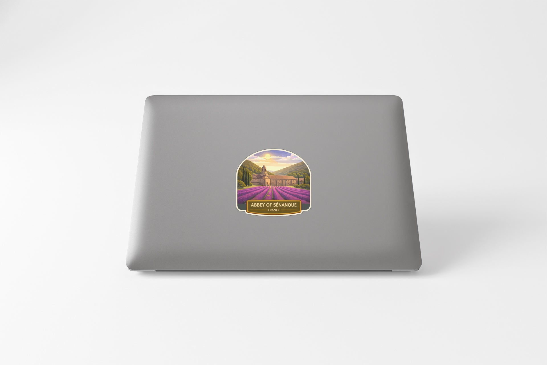 a sticker with a scenic landscape on a laptop.