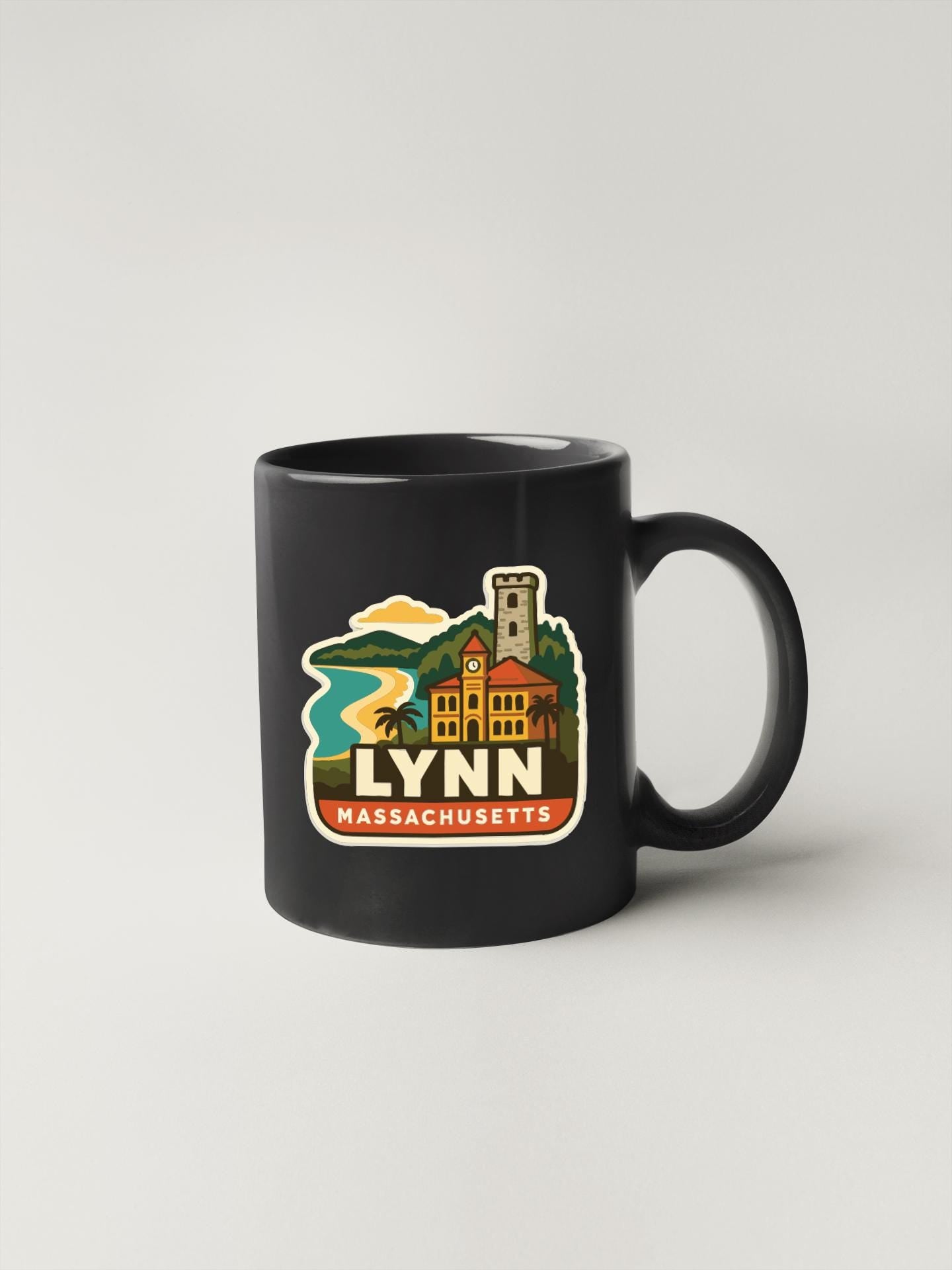 A black coffee mug with a colorful illustration of a building and a clock, along with the text "LYNN MASSACHUSETTS".