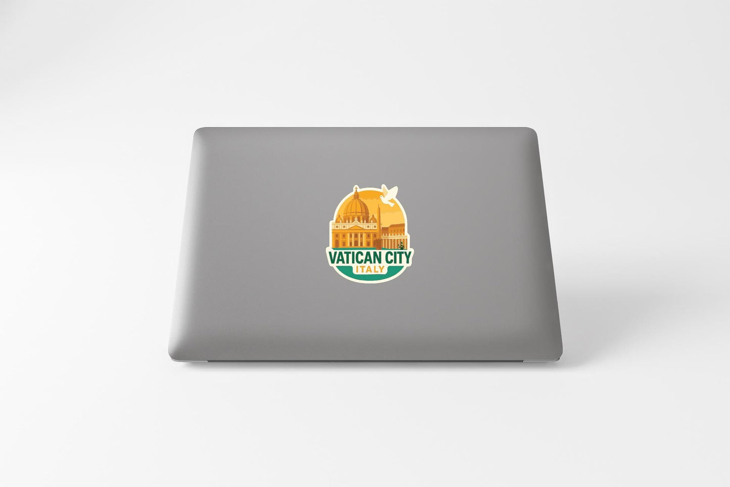 a sticker on the back of a laptop, depicting a cityscape with a dome-shaped building.