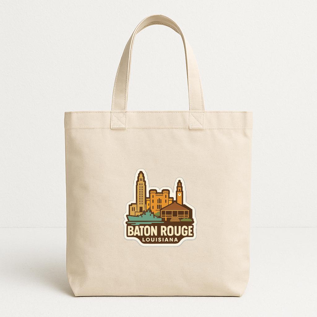 A beige tote bag with a printed logo depicting the city of Baton Rouge, Louisiana.