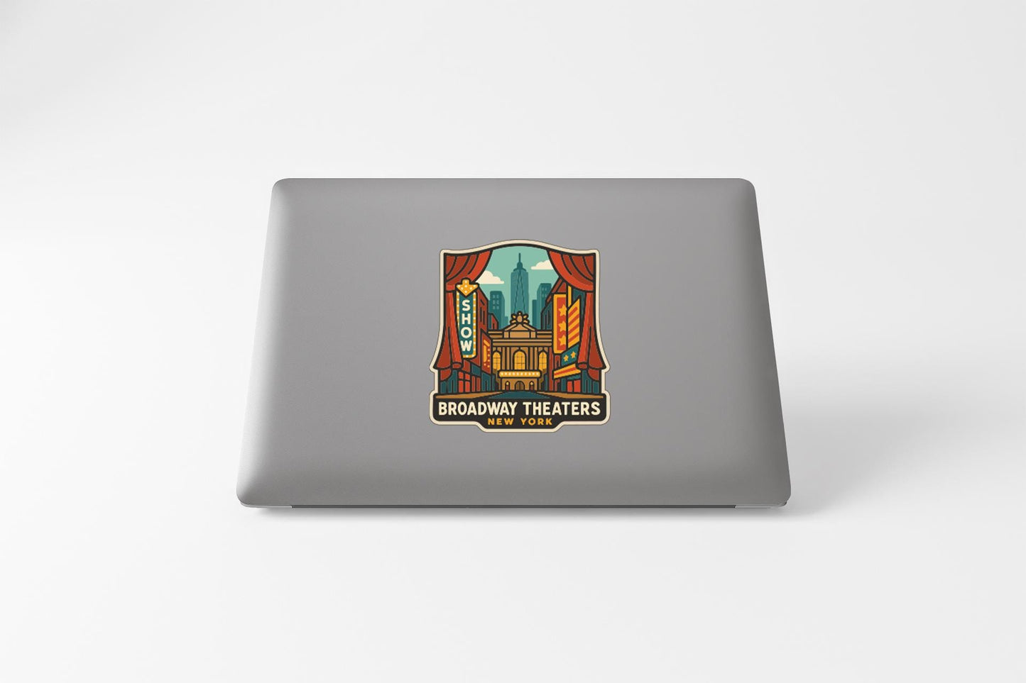 a sticker with a graphic of a theater and the text "Broadway Theaters" on a laptop.