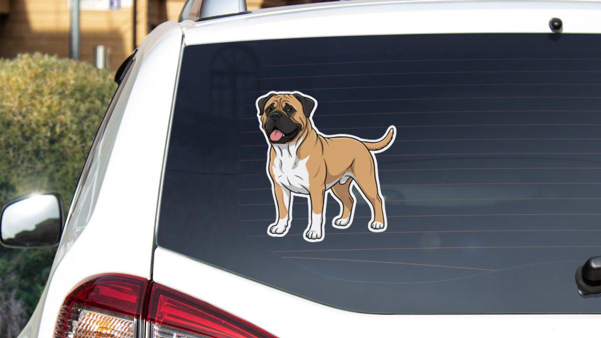 a sticker of a dog on the rear window of a car.