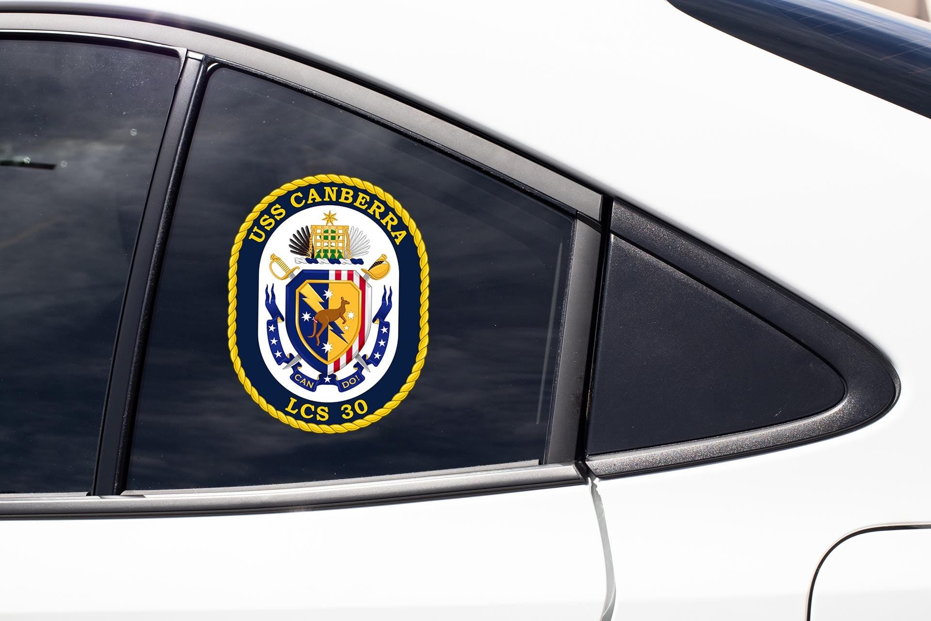 a close up of a car window with a badge on it