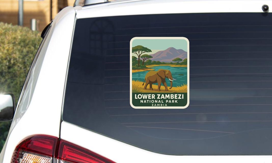 A sticker on the rear window of a car that says "Lower Zambesi National Park, Zambia".