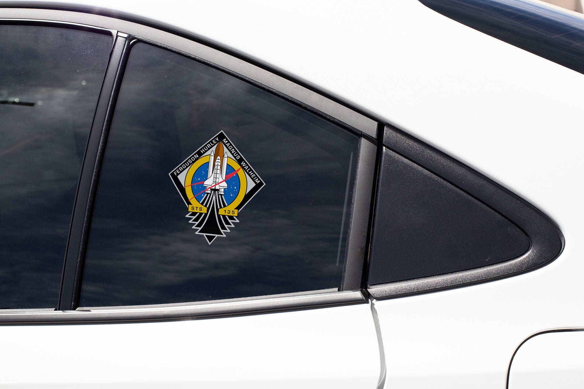 a white car with a sticker on it's side window