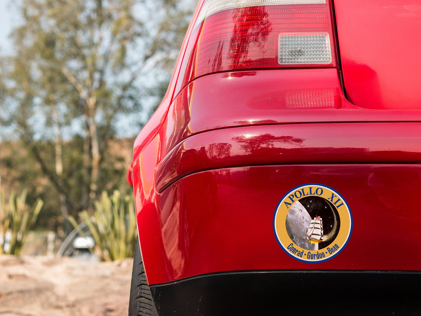 a close up of the rear end of a red car