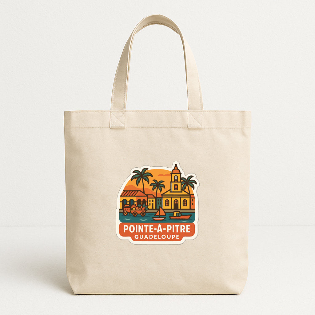 A beige tote bag with a printed design depicting a tropical scene, including palm trees, a church, and a sunset.