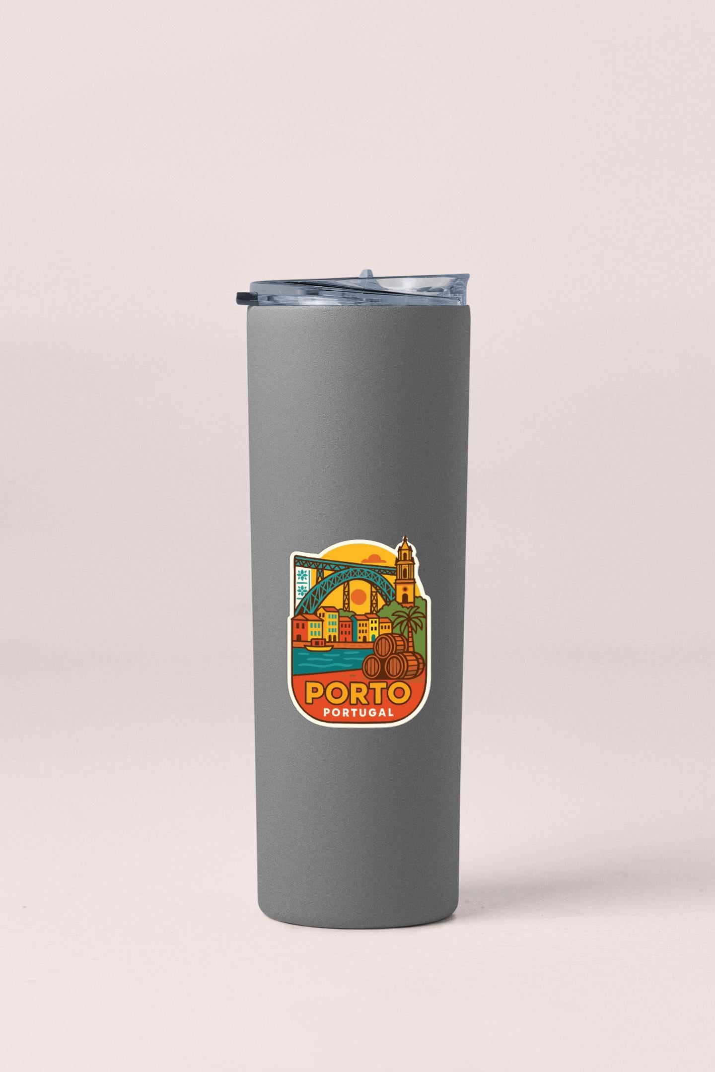 A gray insulated tumbler with a sticker depicting the city of Porto, Portugal.