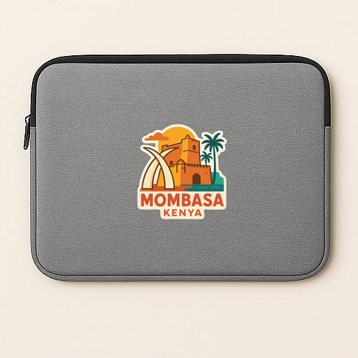 A gray laptop sleeve with a logo of Mombasa, Kenya, featuring a castle, palm trees, and a sunset.